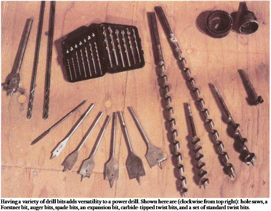 Подпись: Having a variety of drill bits adds versatility to a power drill. Shown here are (clockwise from top right): hole saws, a Forstner bit, auger bits, spade bits, an expansion bit, carbide-tipped twist bits, and a set of standard twist bits. 