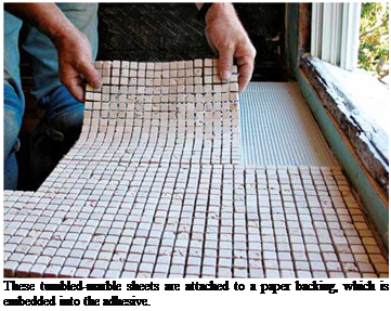 Подпись: These tumbled-marble sheets are attached to a paper backing, which is embedded into the adhesive. 