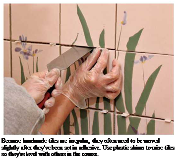 Подпись: Because handmade tiles are irregular, they often need to be moved slightly after they've been set in adhesive. Use plastic shims to raise tiles so they're level with others in the course. 