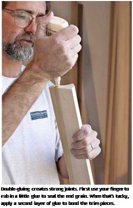 Подпись: Double-gluing creates strong joints. First use your finger to rub in a little glue to seal the end grain. When that's tacky, apply a second layer of glue to bond the trim pieces. 