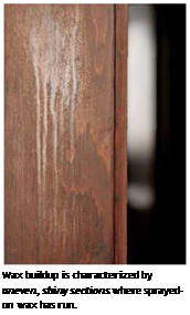 Подпись: Wax buildup is characterized by uneven, shiny sections where sprayed-on wax has run. 