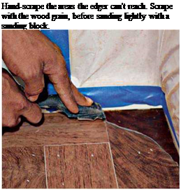 Подпись: Hand-scrape the areas the edger can't reach. Scrape with the wood grain, before sanding lightly with a sanding block. 