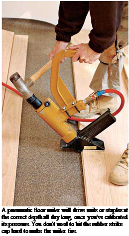 Подпись: A pneumatic floor nailer will drive nails or staples at the correct depth all day long, once you've calibrated its pressure. You don't need to hit the rubber strike cap hard to make the nailer fire. 