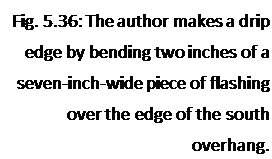 Подпись: Fig. 5.36: The author makes a drip edge by bending two inches of a seven-inch-wide piece of flashing over the edge of the south overhang. 