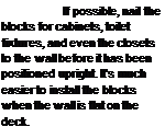 Подпись: If possible, nail the blocks for cabinets, toilet fixtures, and even the closets to the wall before it has been positioned upright. It's much easier to install the blocks when the wall is flat on the deck.