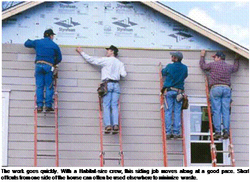 Подпись: The work goes quickly. With a Habitat-size crew, this siding job moves along at a good pace. Short offcuts from one side of the house can often be used elsewhere to minimize waste. 
