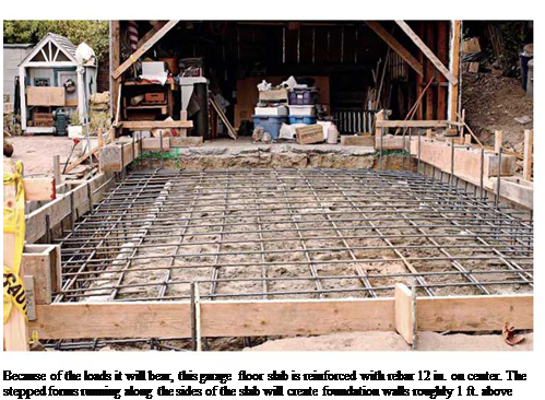 Подпись: Because of the loads it will bear, this garage floor slab is reinforced with rebar 12 in. on center. The stepped forms running along the sides of the slab will create foundation walls roughly 1 ft. above grade. 